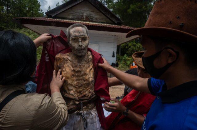 Chilling Tradition, They Exhume the Dead, Dress and Decorate 54 Chilling Tradition They Exhume the Dead Dress and Decorate